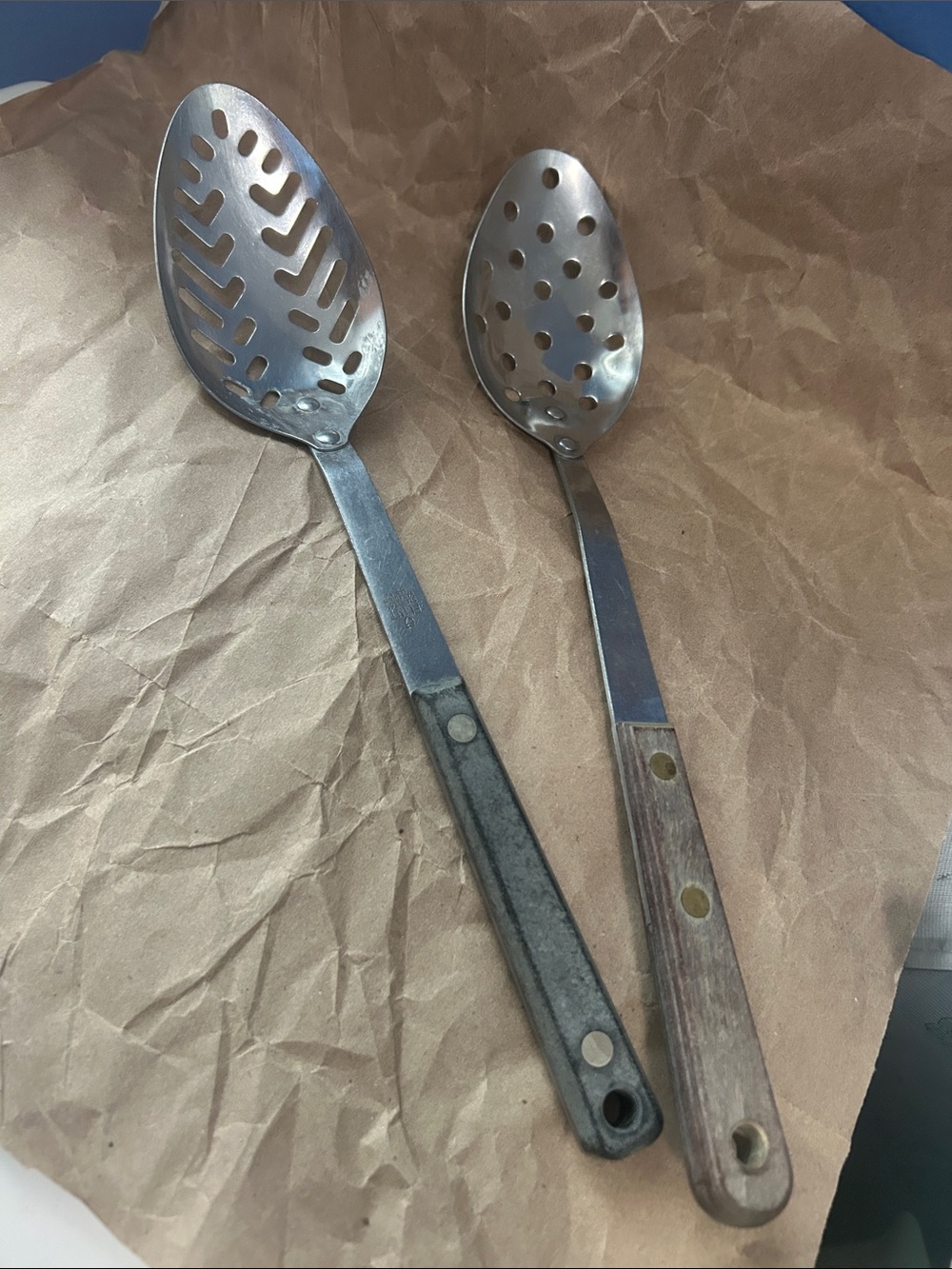 Set of Two Metal Slotted Serving Spoons with Gray and Brown Handles